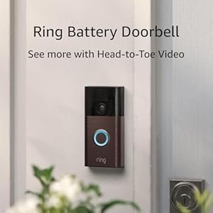 Ring Battery Video Doorbell mounted outside a front door, featuring head-to-toe video capture, motion alerts, and a glowing blue ring button. Enhances smart home security with wireless installation. Featured on MTNestersTechGadgets.com.