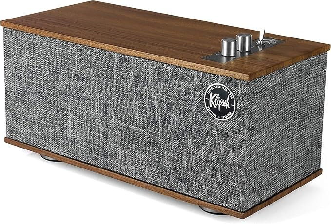 Klipsch The One II Bluetooth tabletop speaker in a sleek wood and fabric design, one of the best Klipsch Speakers 2025 for premium home audio.