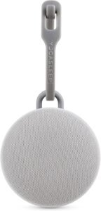 Yogasleep Hushh portable baby sound machine in gray with clip-on strap, compact design for travel, stroller, and nursery use.